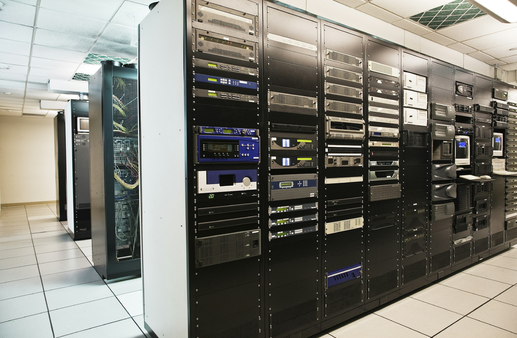 Storage racks aligned in a computer server room.