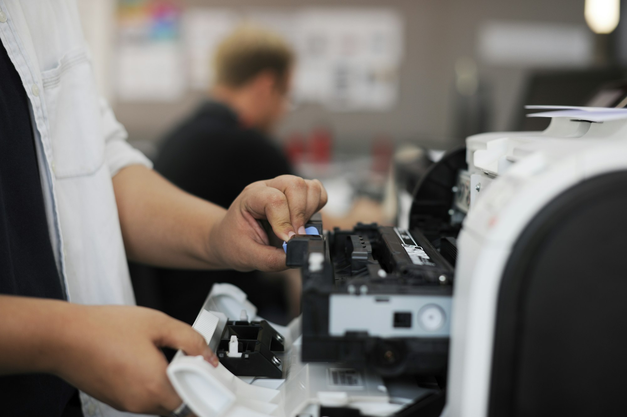 People Hands Opening Checking Printer in Office